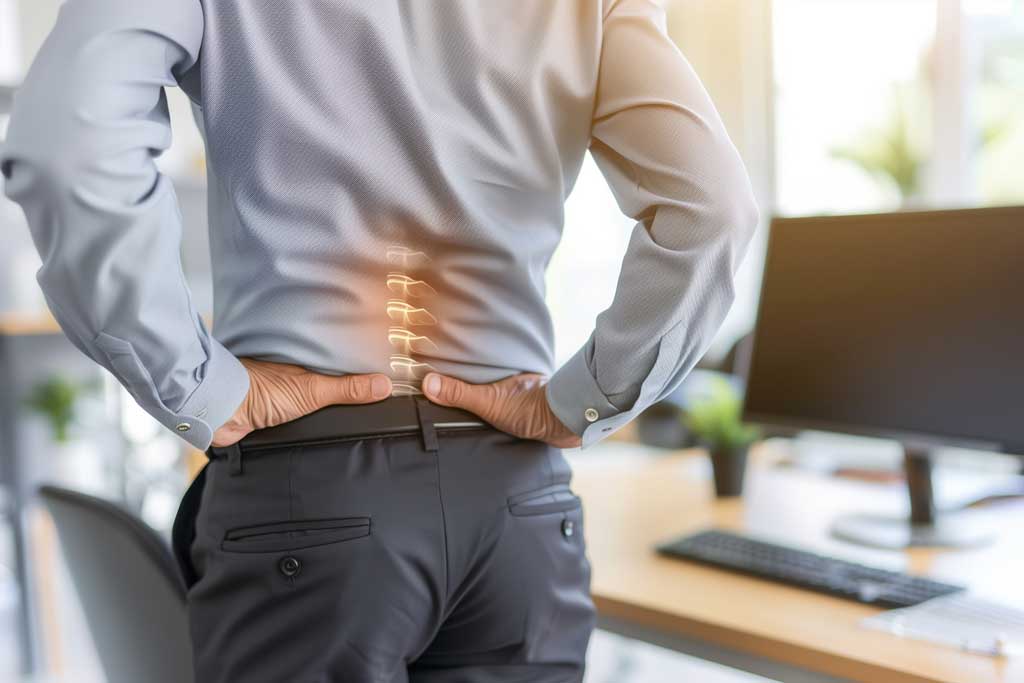 58488306_man-experiencing-back-pain-in-office