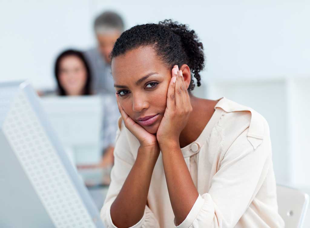 7074572_bored-young-businesswoman-at-her-desk