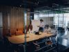 A diverse team is energetically brainstorming and collaborating together in a bright, contemporary office space